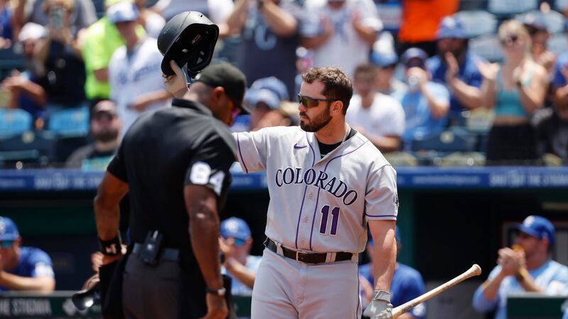 Colorado Rockies' Mike Moustakas gets a standing ovation from fans of his former team during...