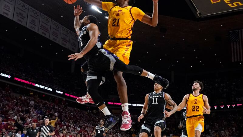 Iowa State center Osun Osunniyi (21) blocks a shot by Kansas State guard Markquis Nowell (1)...