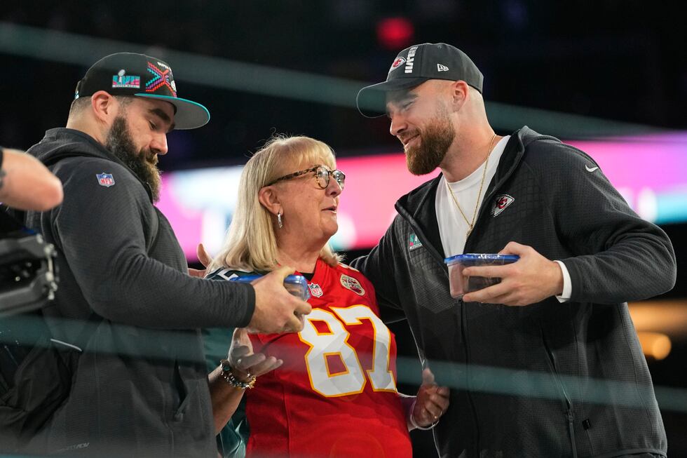 Donna Kelce greets her sons, Philadelphia Eagles center Jason Kelce, left, and Kansas City...