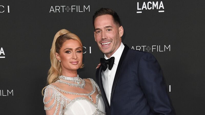 FILE - Paris Hilton, left, and Carter Reum appear at the LACMA Art + Film Gala in Los Angeles...