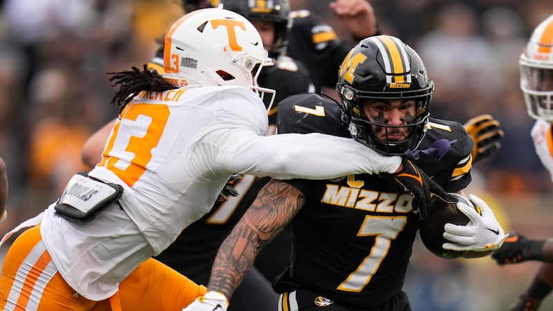 Missouri running back Cody Schrader (7) runs with the ball as Tennessee defensive back Wesley...