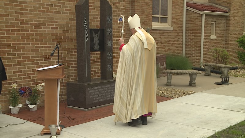 Archbishop Joseph Naumann of the Archdiocese of Kansas City, Kansas prays over the new...