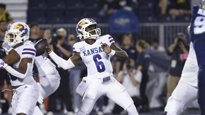 Kansas quarterback Jalon Daniels throws a pass against Nevada during the first half of an NCAA...
