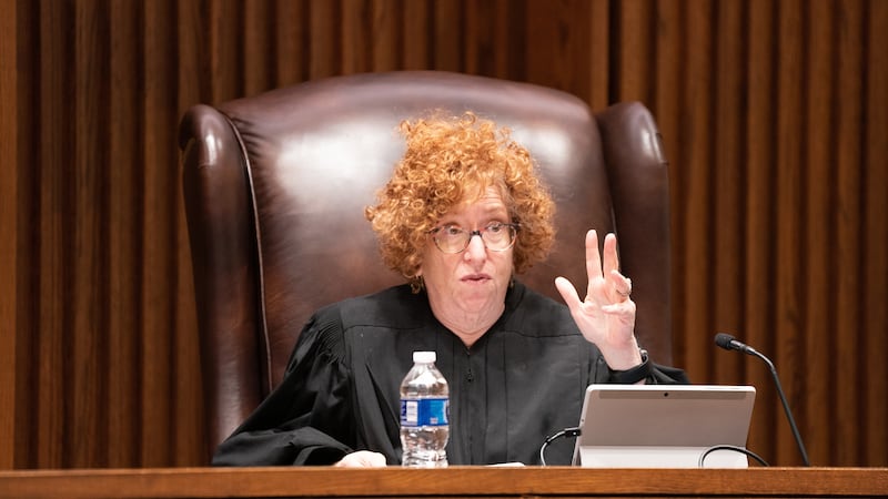 Kansas Supreme Court Justice Melissa Standridge questions Bradley Schlozman during arguments...