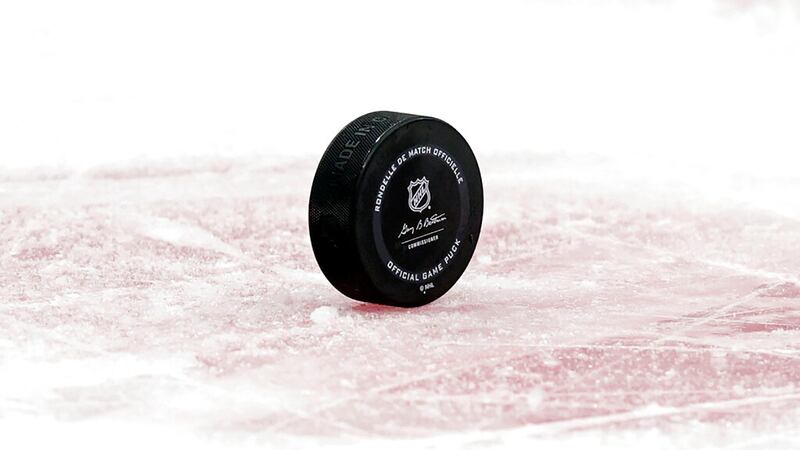 A hockey puck is seen in the second period of an NHL hockey game between the Seattle Kraken...