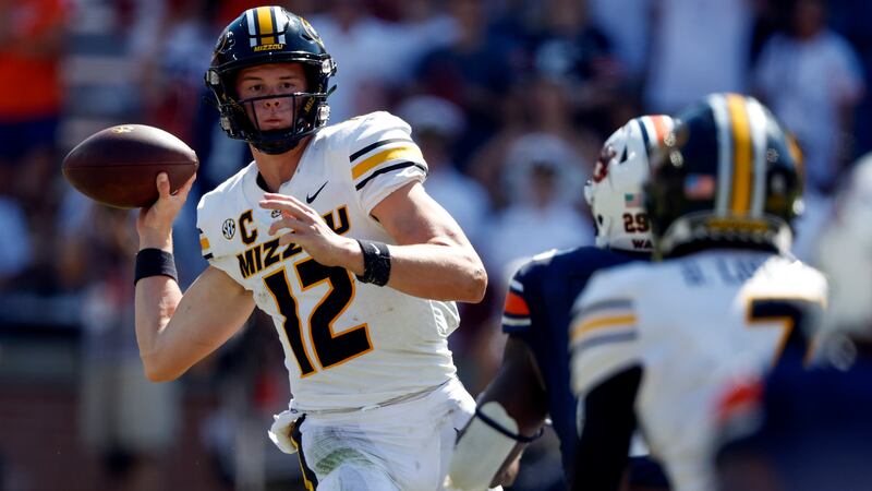 Missouri quarterback Brady Cook (12) throws a pass against Auburn during the second half of an...
