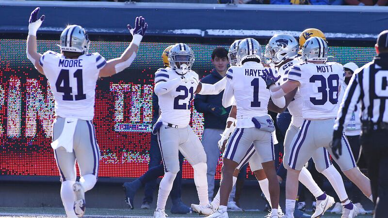 Kansas State players celebrate after a defensive touchdown against West Virginia during the...