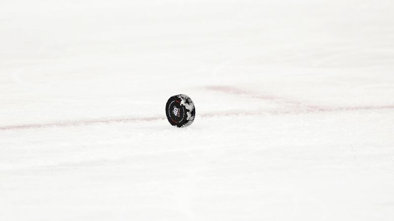 A hockey puck is seen during the second period of Game 3 of an NHL hockey Stanley Cup...