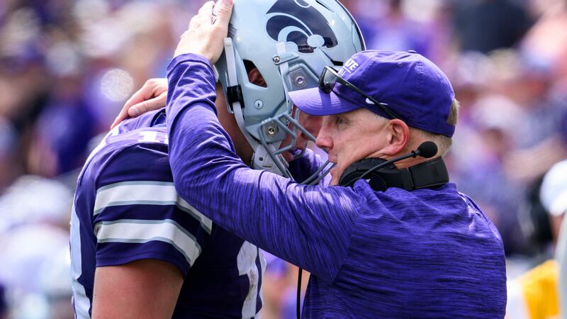 Kansas State head coach Chris Klieman, right, talks to Kansas State quarterback Will Howard,...