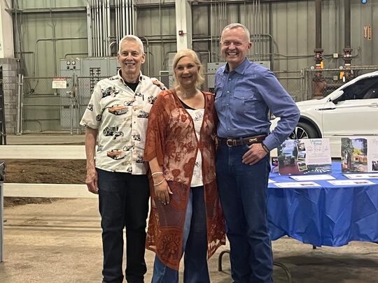 From left to right, Jim Modica, Lisa Hillmer and Jeff Winton, pose for photos ahead of the...