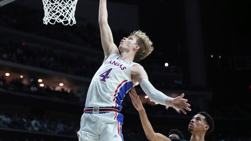 Kansas's Gradey Dick shoots past Howard's Steve Settle III during the first half of a...