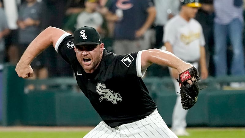 Chicago White Sox relief pitcher Liam Hendriks reacts after striking out Oakland Athletics'...