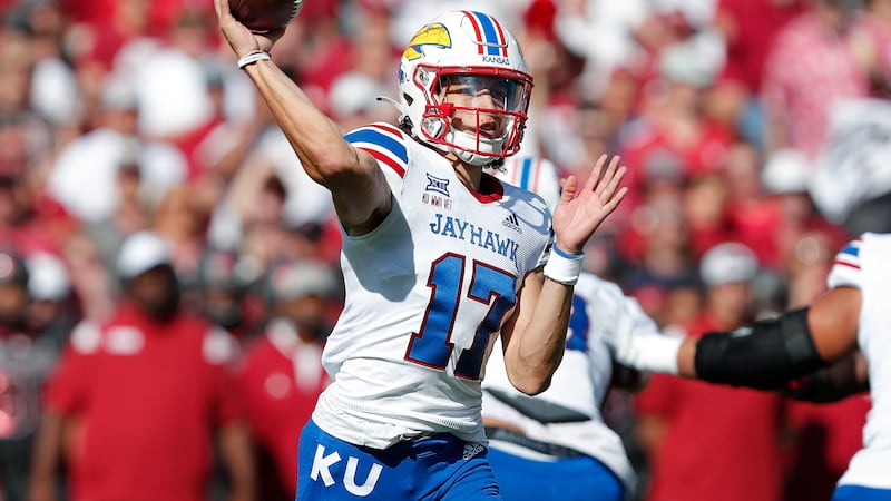 Kansas quarterback Jason Bean (17) throws a pass against Oklahoma during the first half of an...