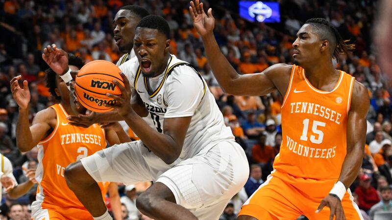 Missouri forward Mohamed Diarra grabs a rebound as Tennessee guard Jahmai Mashack (15) defends...