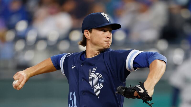 Kansas City Royals starting pitcher Brady Singer throws to a Seattle Mariners batter during...