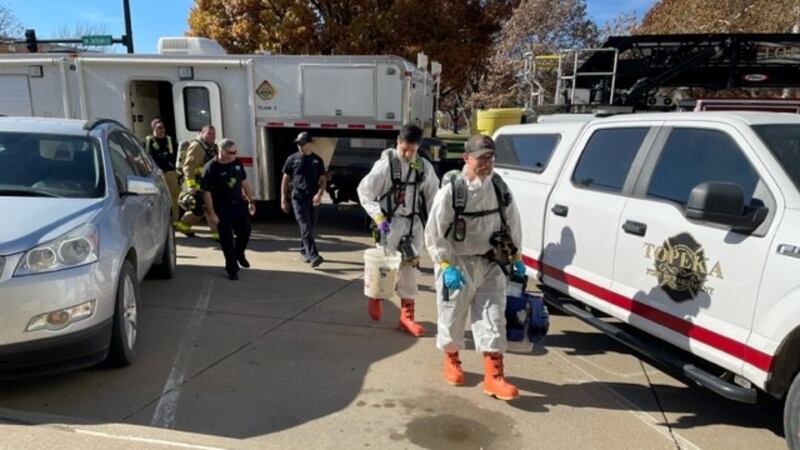 Hazmat crews enter Memorial Hall after employees are evacuated on Nov. 14, 2023.