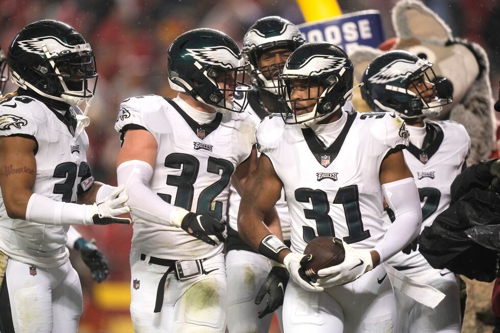 Philadelphia Eagles safety Kevin Byard (31) is congratulated by teammates after intercepting a...